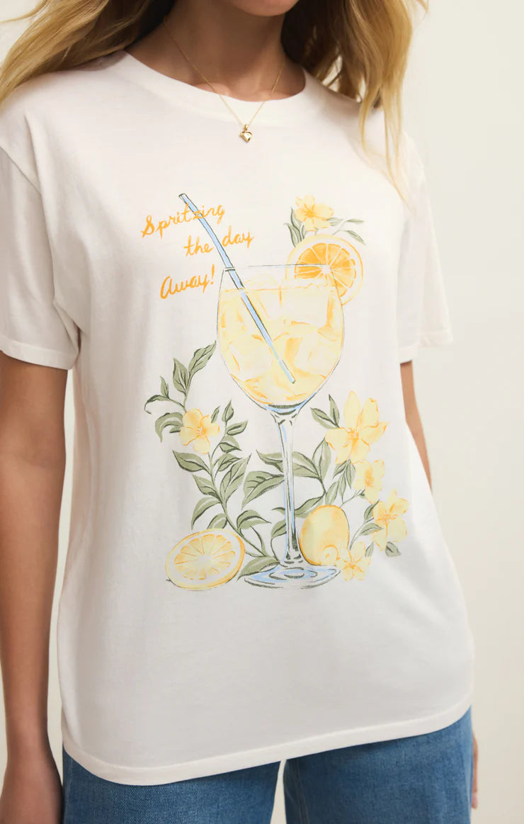 White t-shirt with a lemon-themed graphic and text, worn by a person.