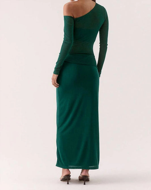 Green evening gown with long sleeves on a white background