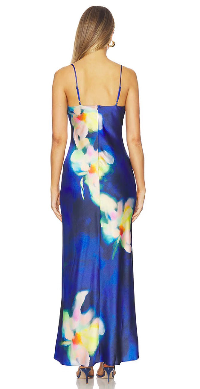 Woman wearing a blue floral dress on a white background