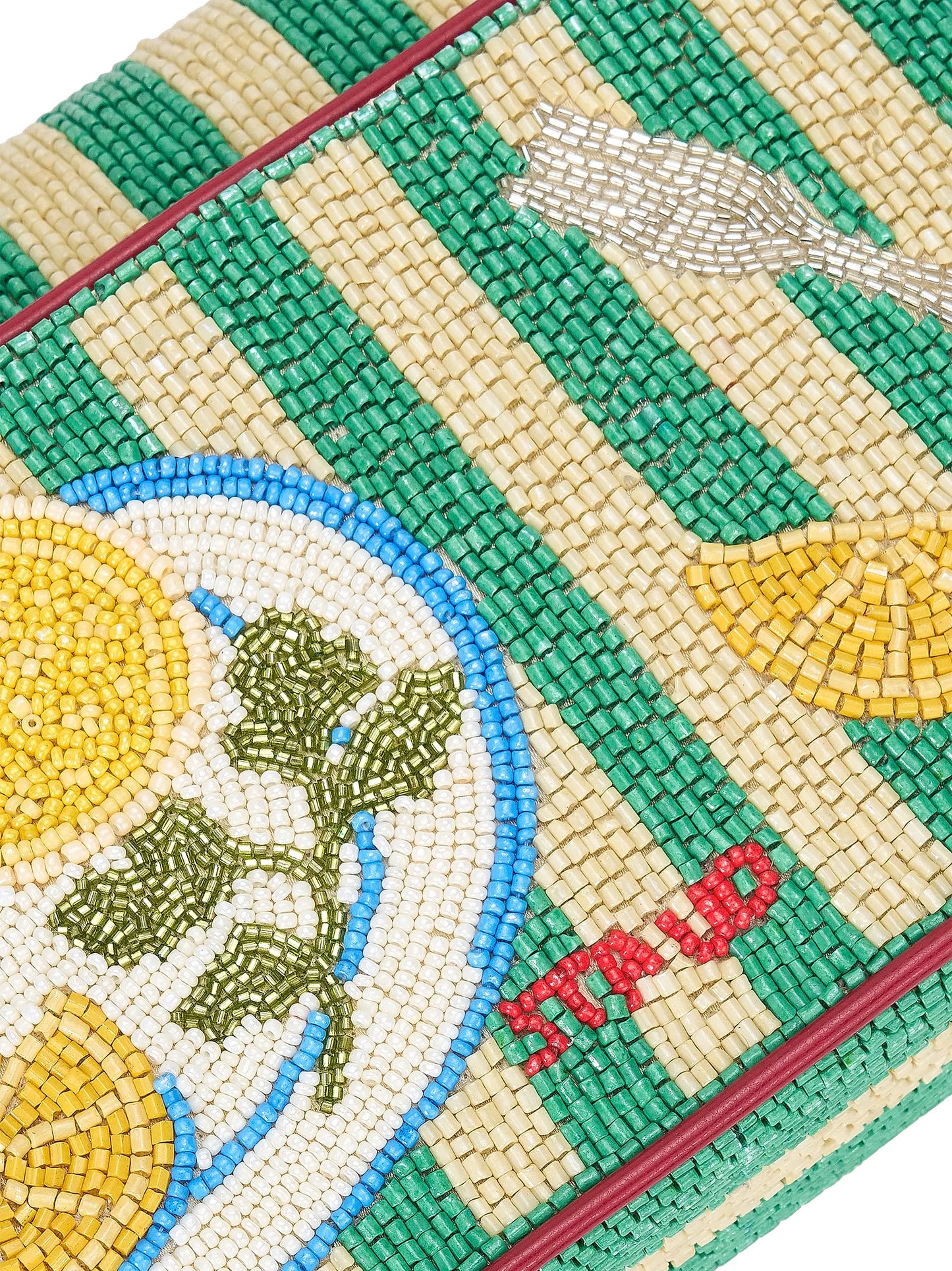 Close-up of a beaded pouch with green, yellow, and red patterns and a visible brand logo.