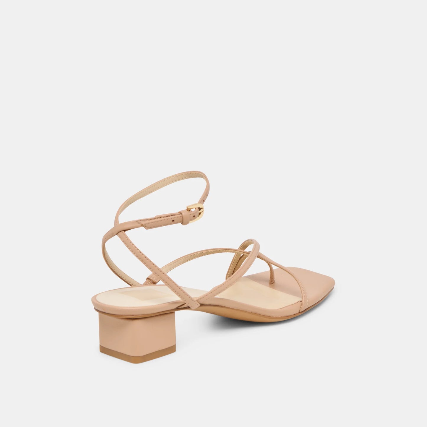 Beige sandal with a block heel on a light gray background