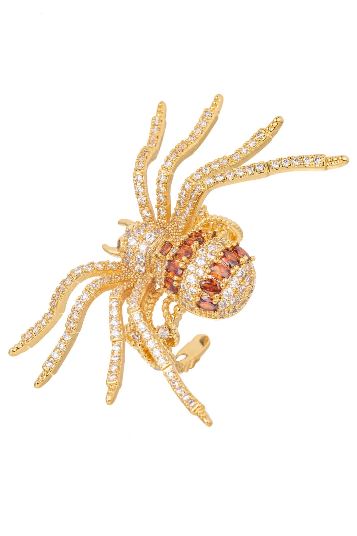 A gold spider ring embellished with pavé-set clear stones and a central cluster of round pinkish-brown gemstones, shown on a plain white background.