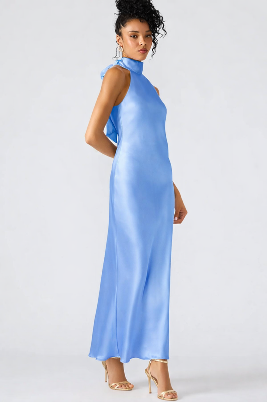 Model wearing Steve Madden Lara Maxi Dress in Aurora Blue with high neckline and sleek satin finish