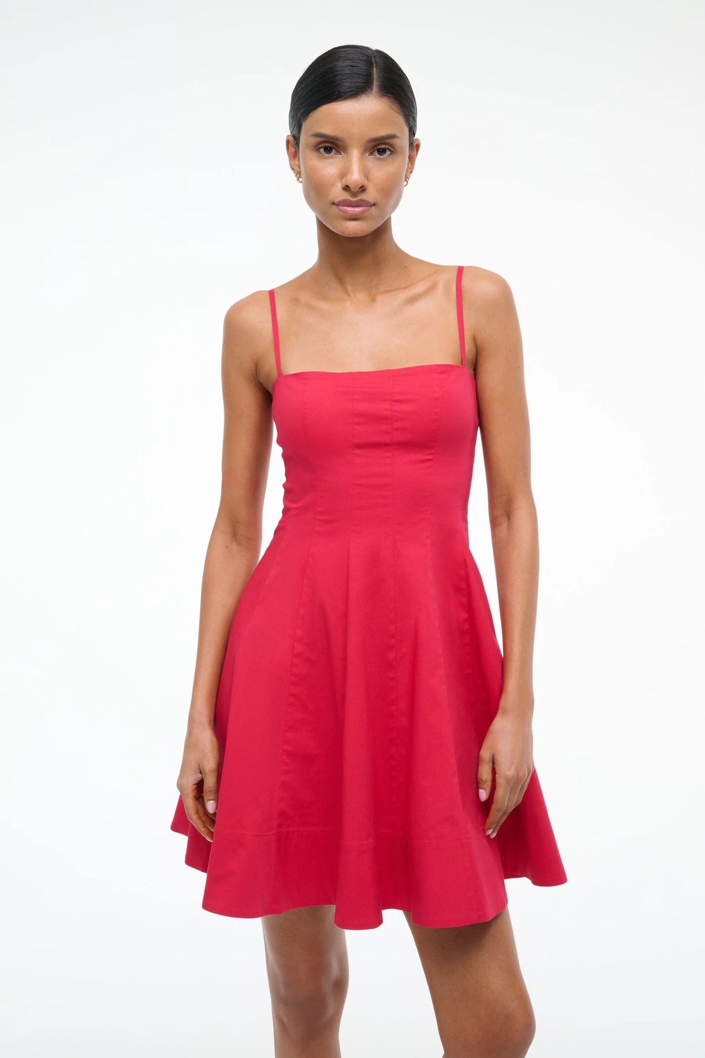 Woman wearing a red dress on a white background
