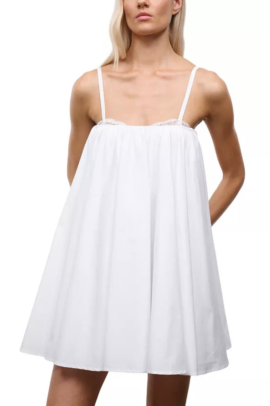 White dress worn by a model on a white background