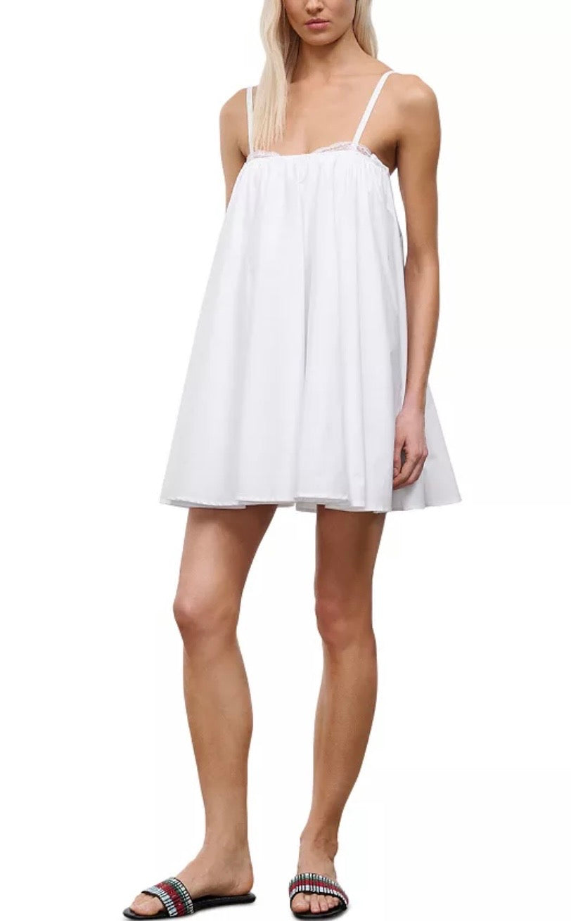 Woman wearing a white dress on a white background