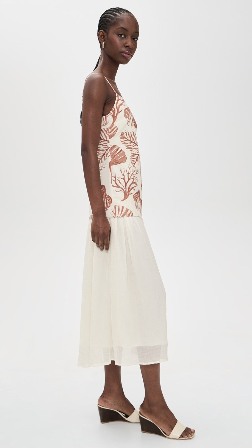Woman wearing a floral dress with a white background