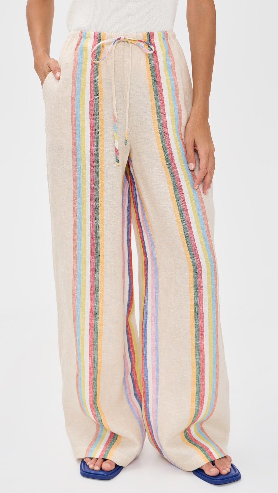 Beige pants with colorful stripes on a white background