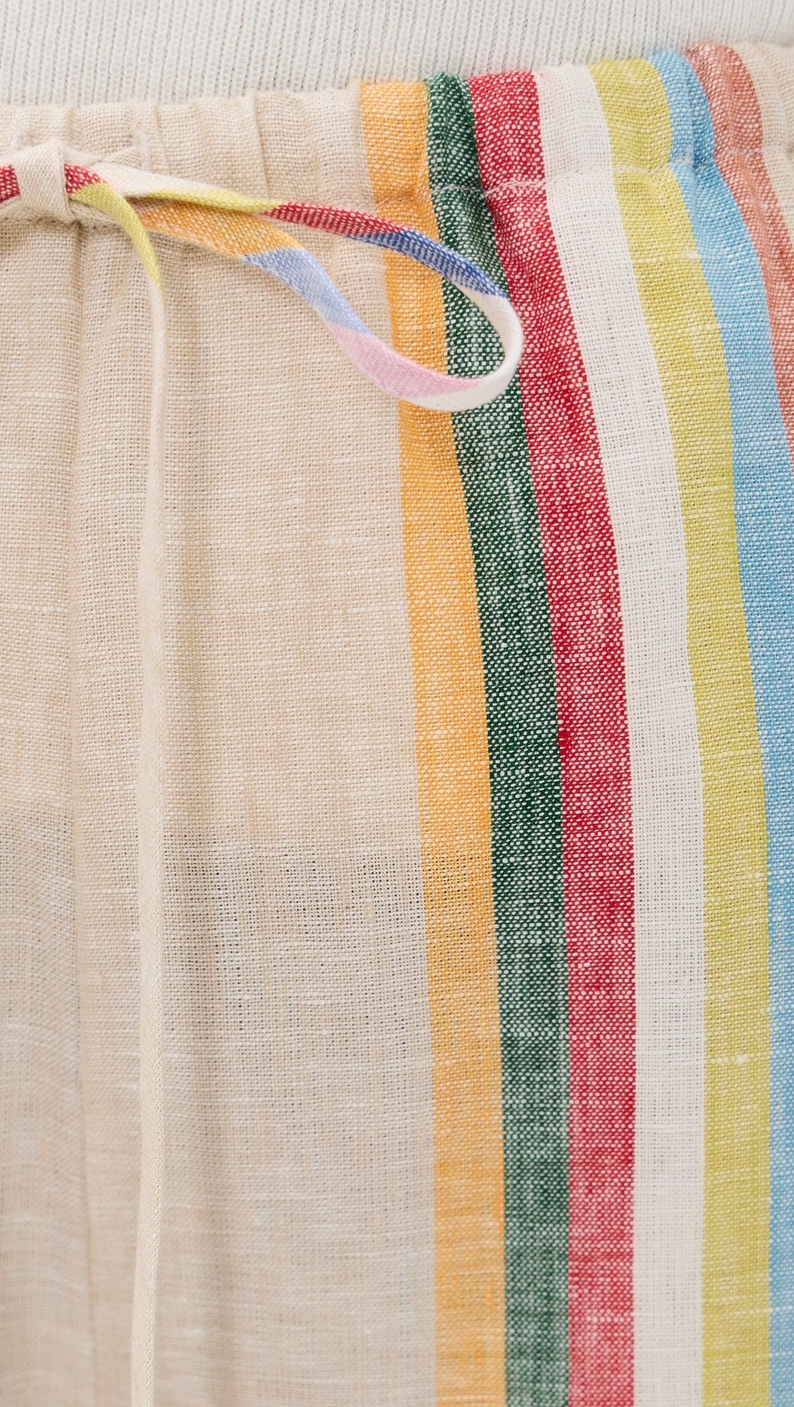 Textile with colorful stripes on a beige background