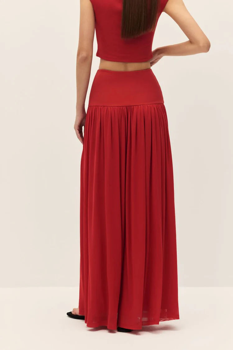 Red dress with a long skirt and fitted top on a white background