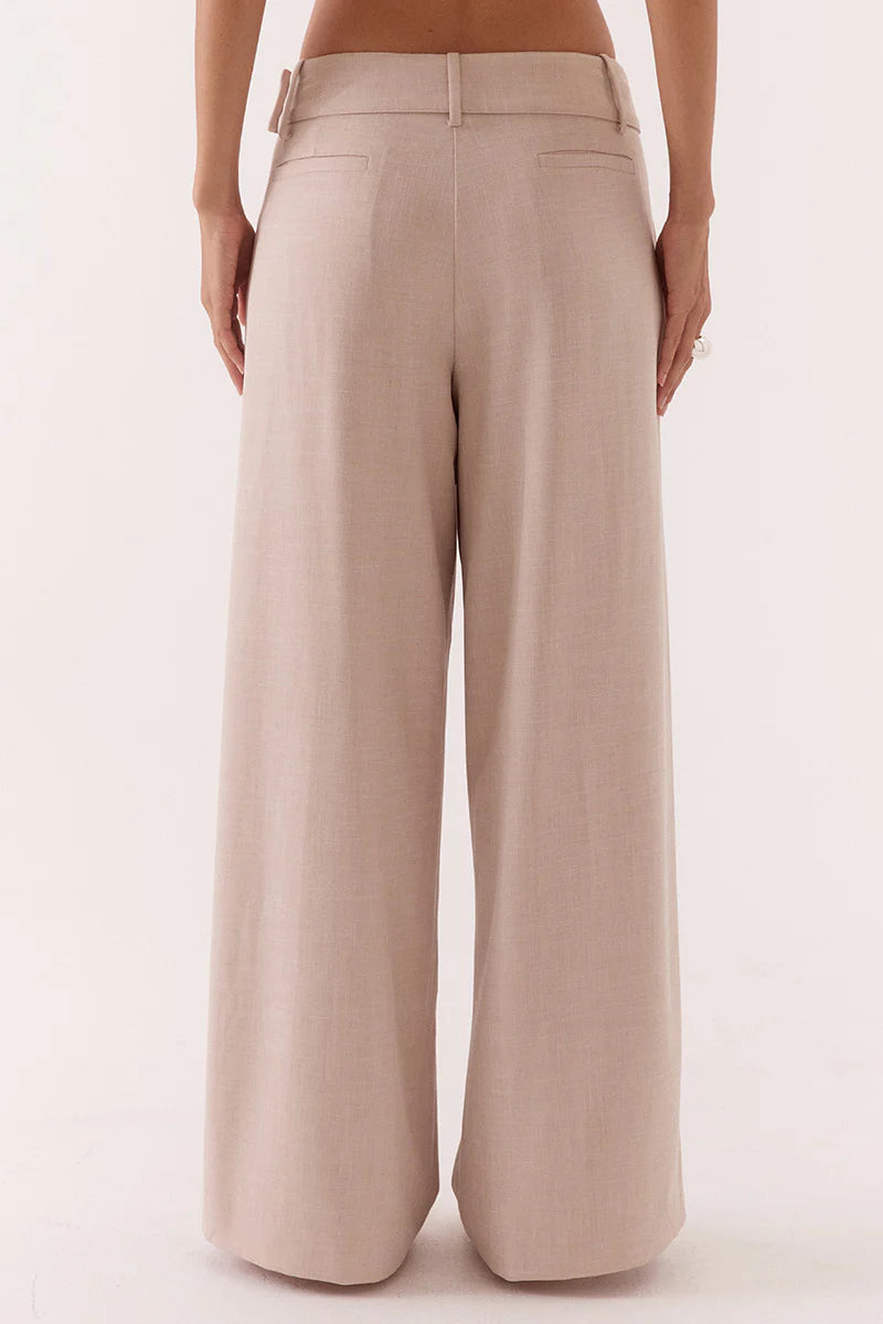 Beige wide-leg pants on a white background