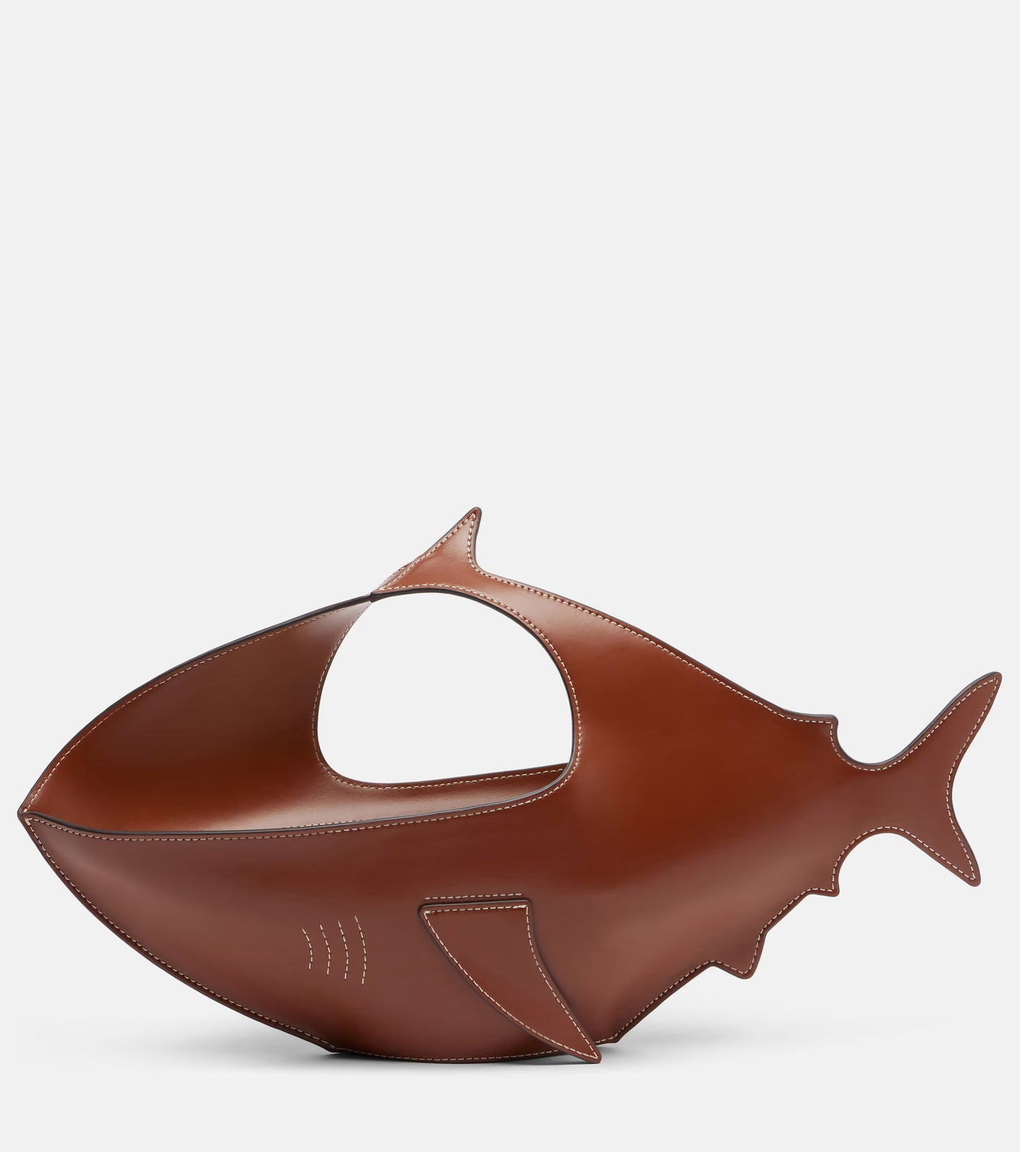 Brown fish-shaped object on a white background