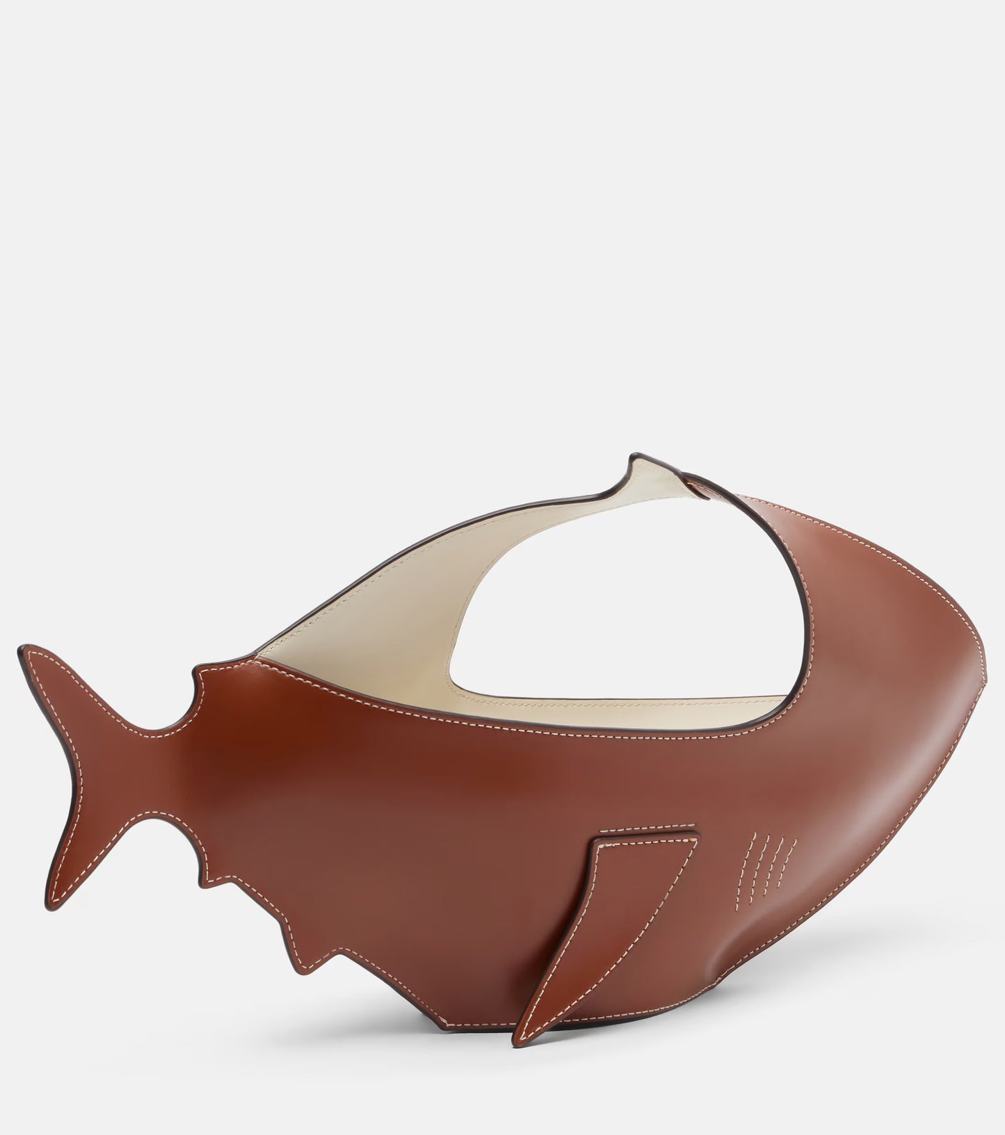 Brown fish-shaped object on a white background
