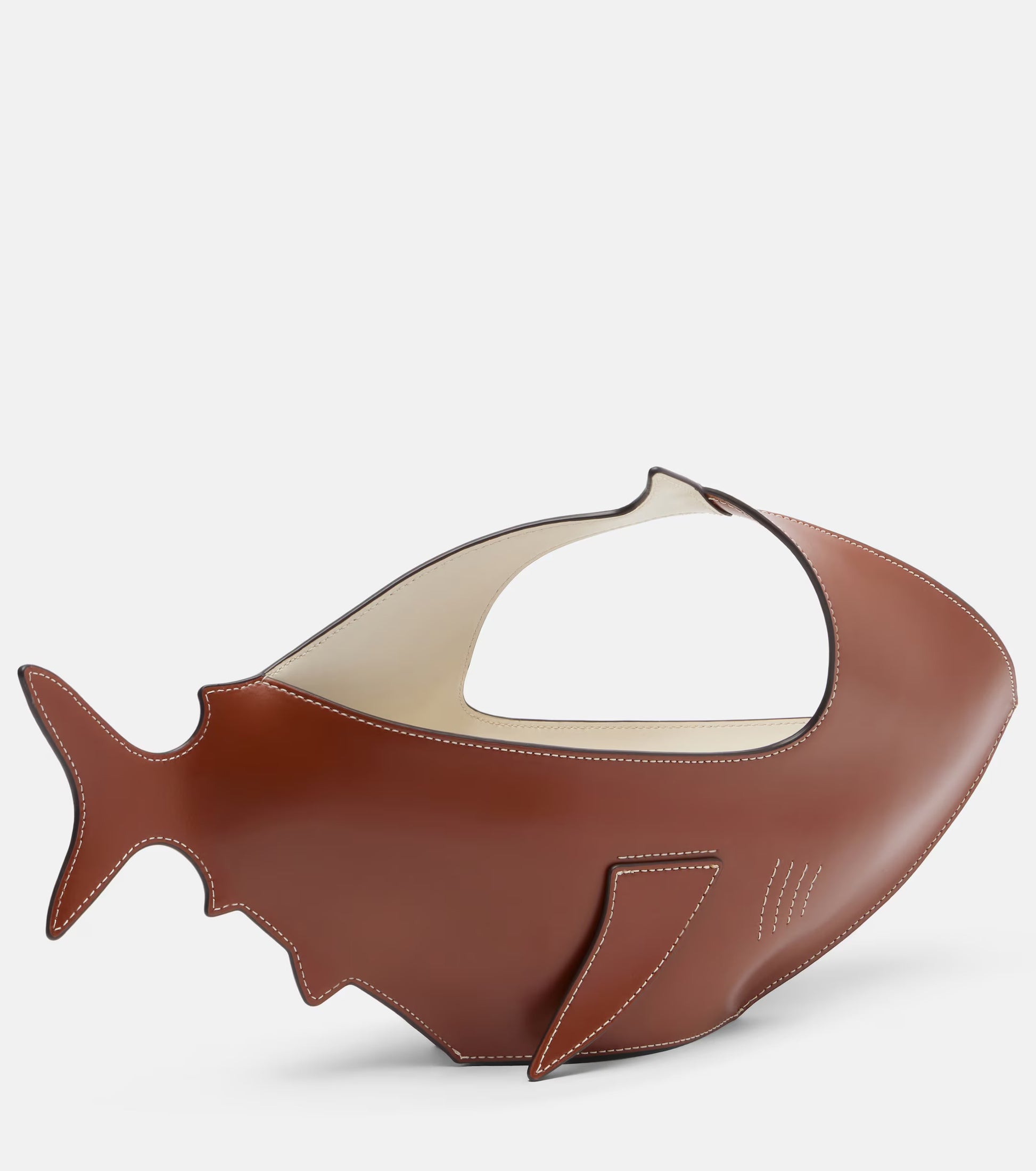 Brown fish-shaped object on a white background