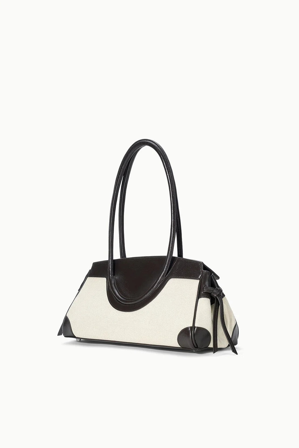 Handbag with black handle and contrasting color design on a white background
