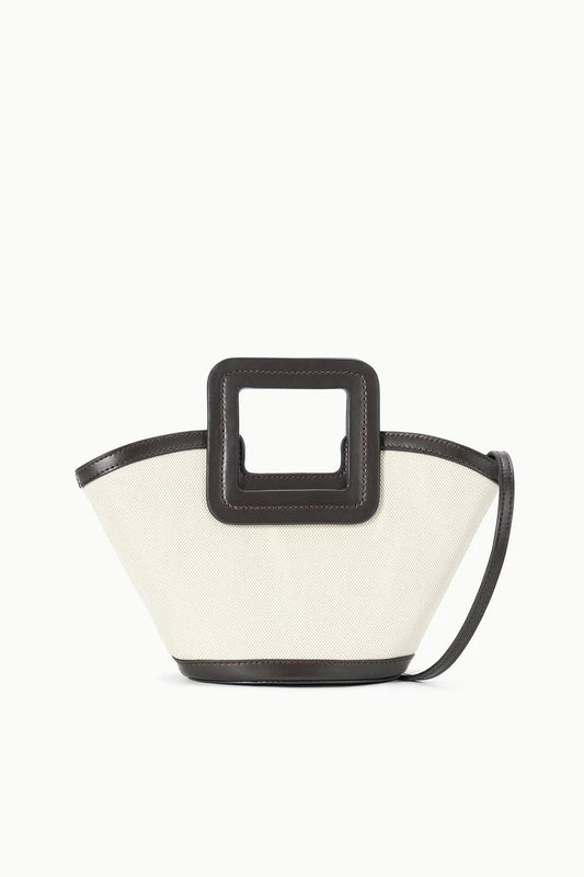 Small handbag with a black handle and white body on a white background
