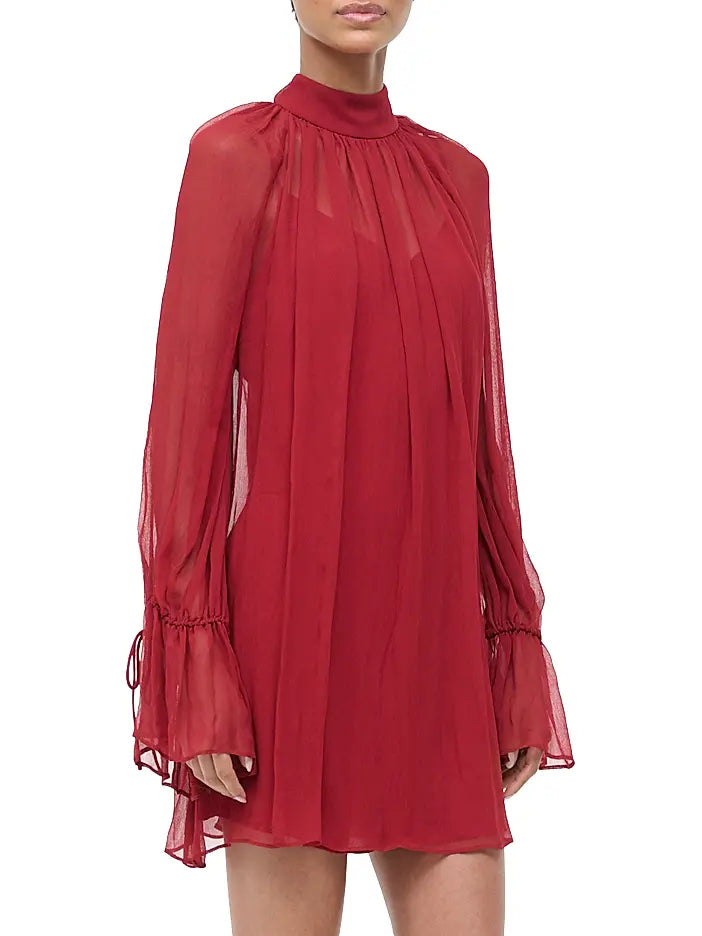 Red dress with sheer sleeves on a white background