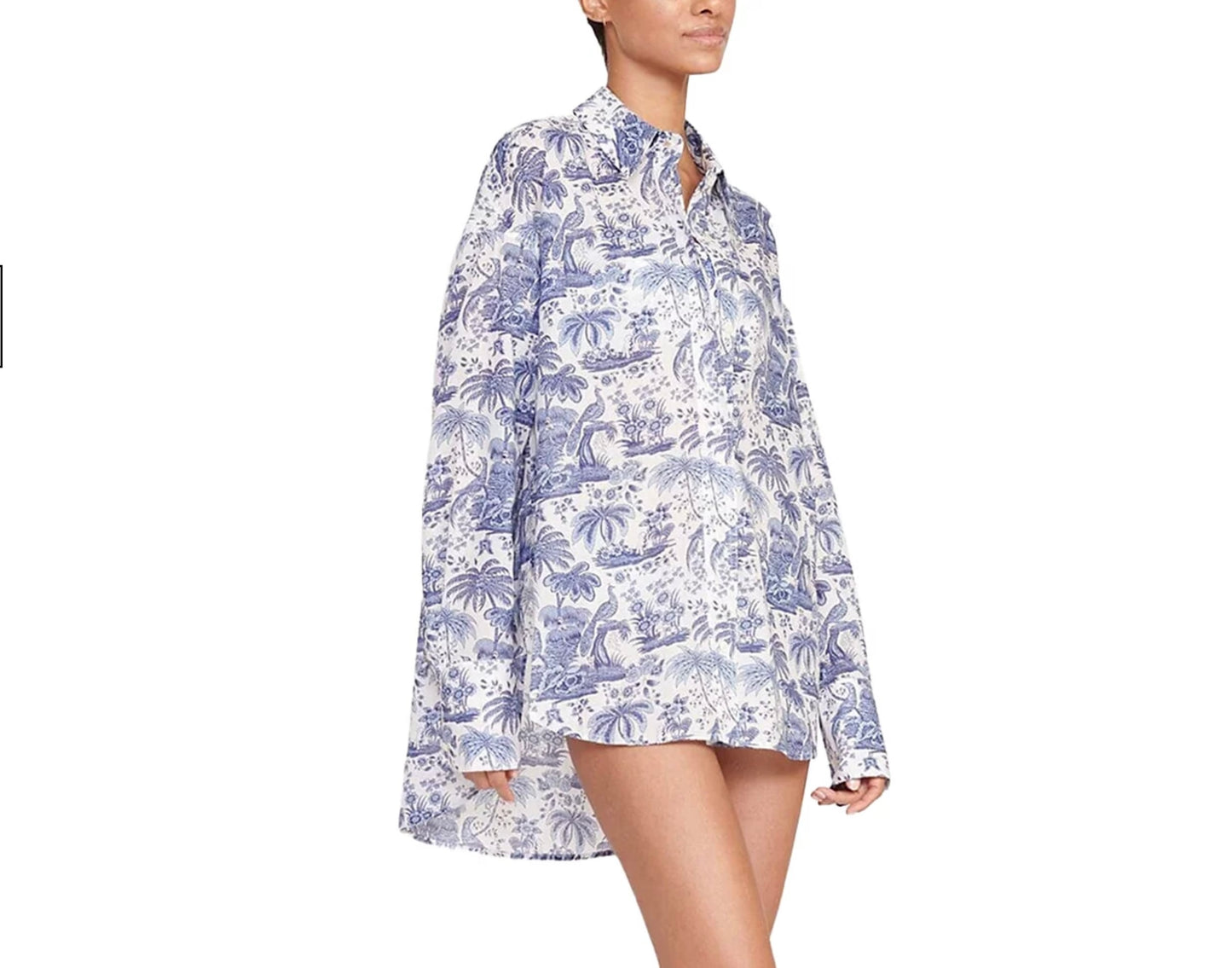 Woman wearing a blue and white floral patterned shirt on a white background