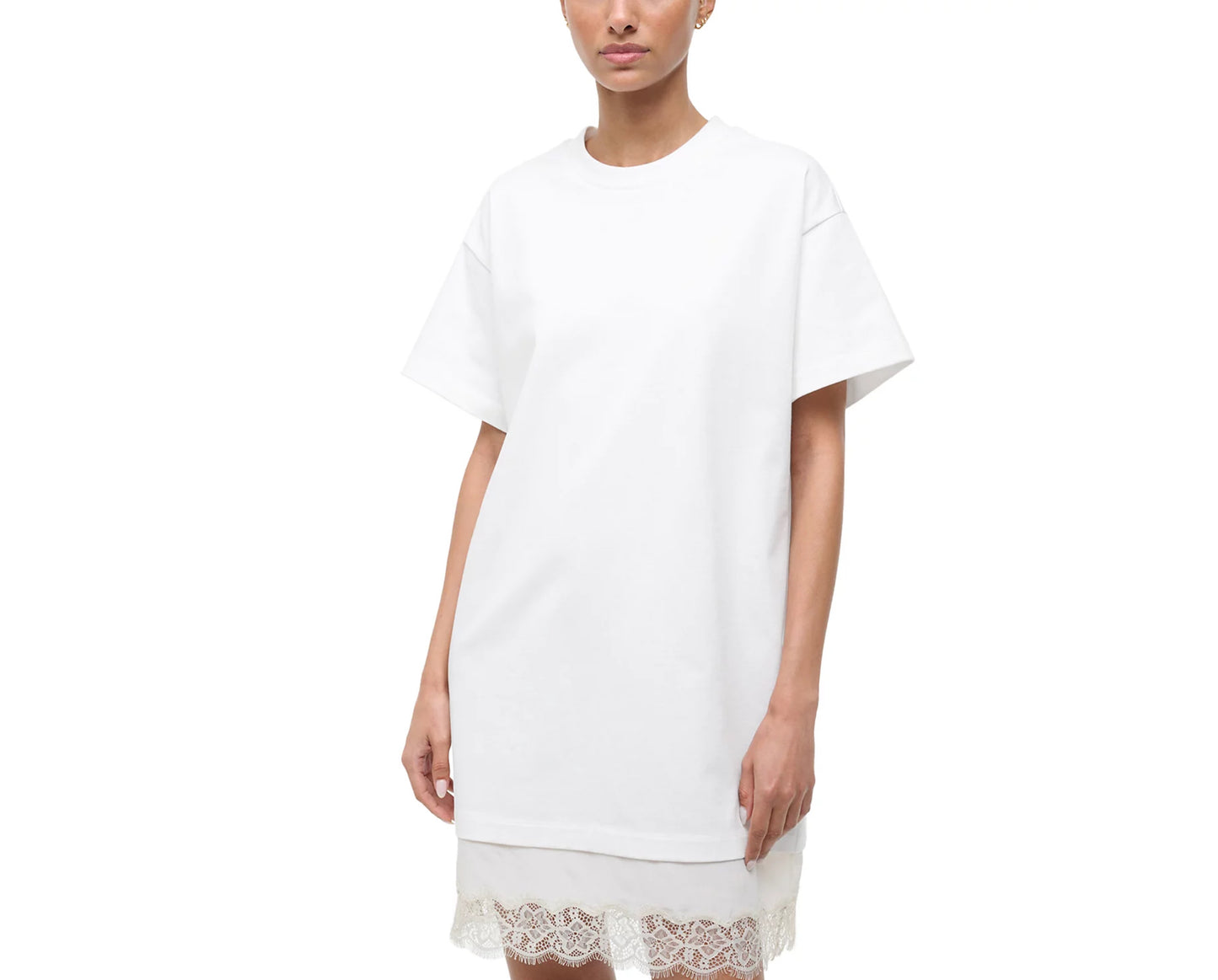 White t-shirt dress with lace trim worn by a model on a white background