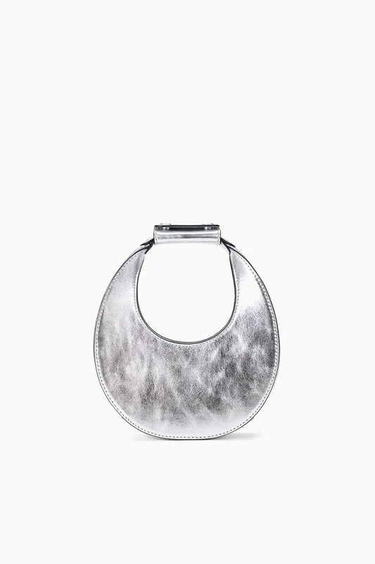 Round metallic silver clutch on a white background