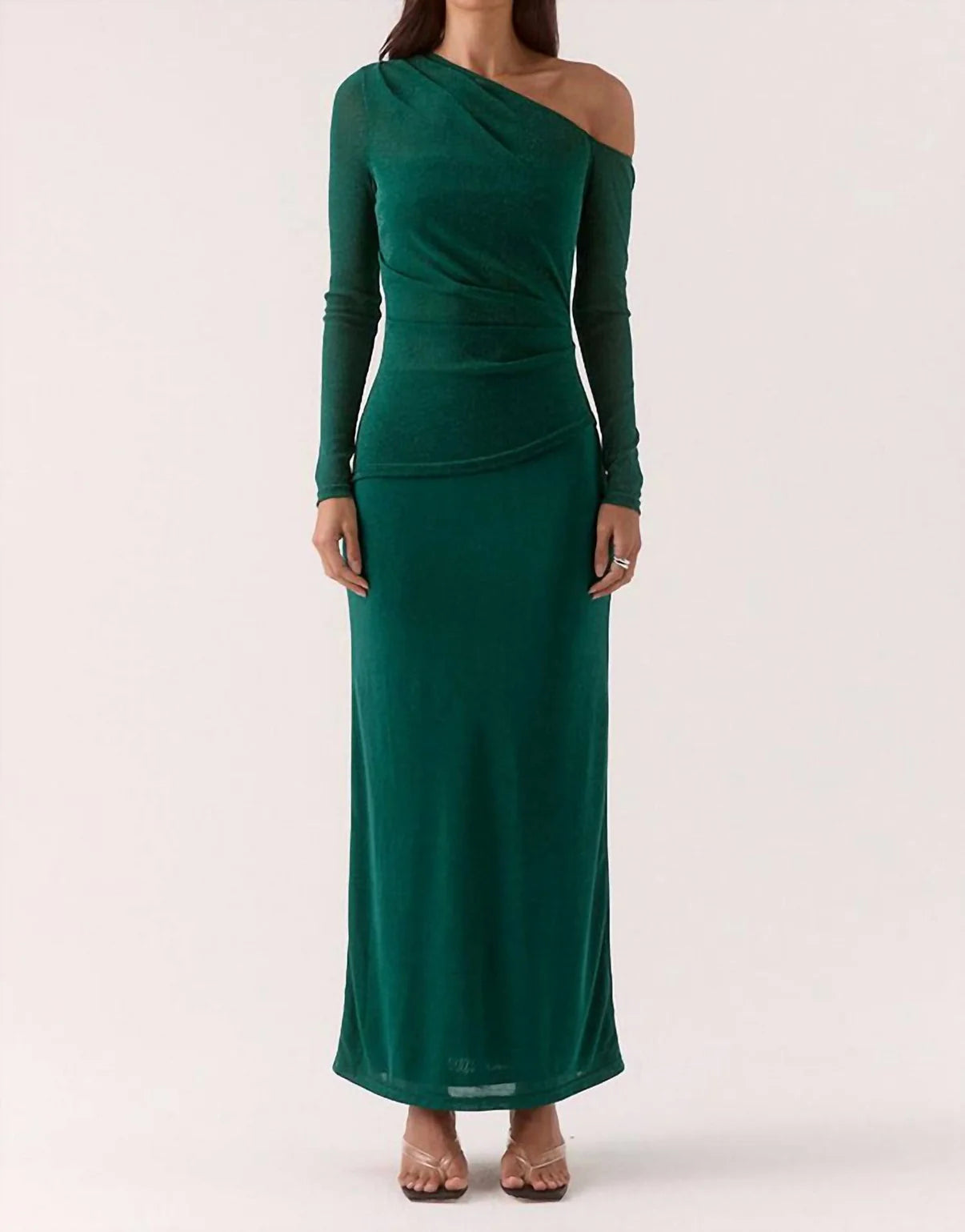 Green one-shoulder dress worn by a model on a white background