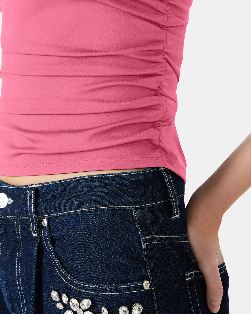 Pink top and blue jeans with decorative elements on a white background