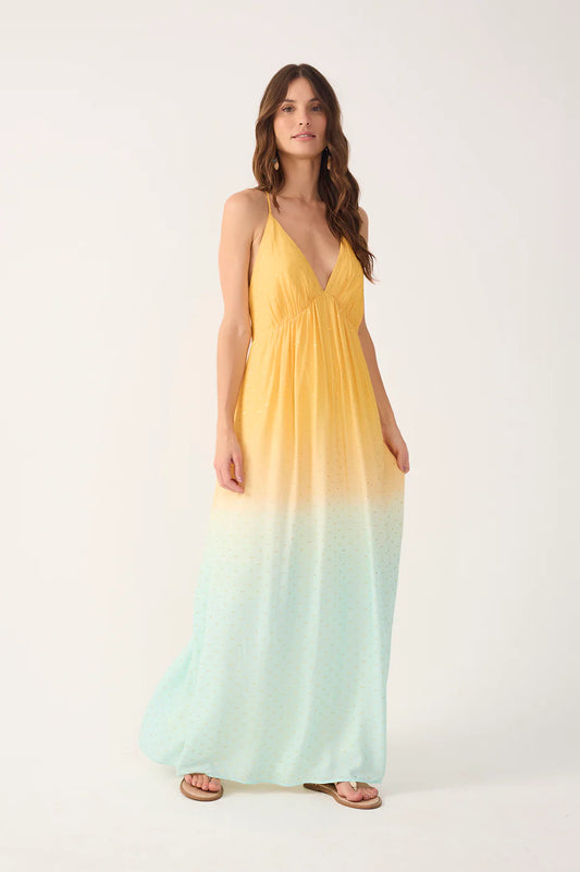 Woman wearing a yellow to green gradient dress on a white background