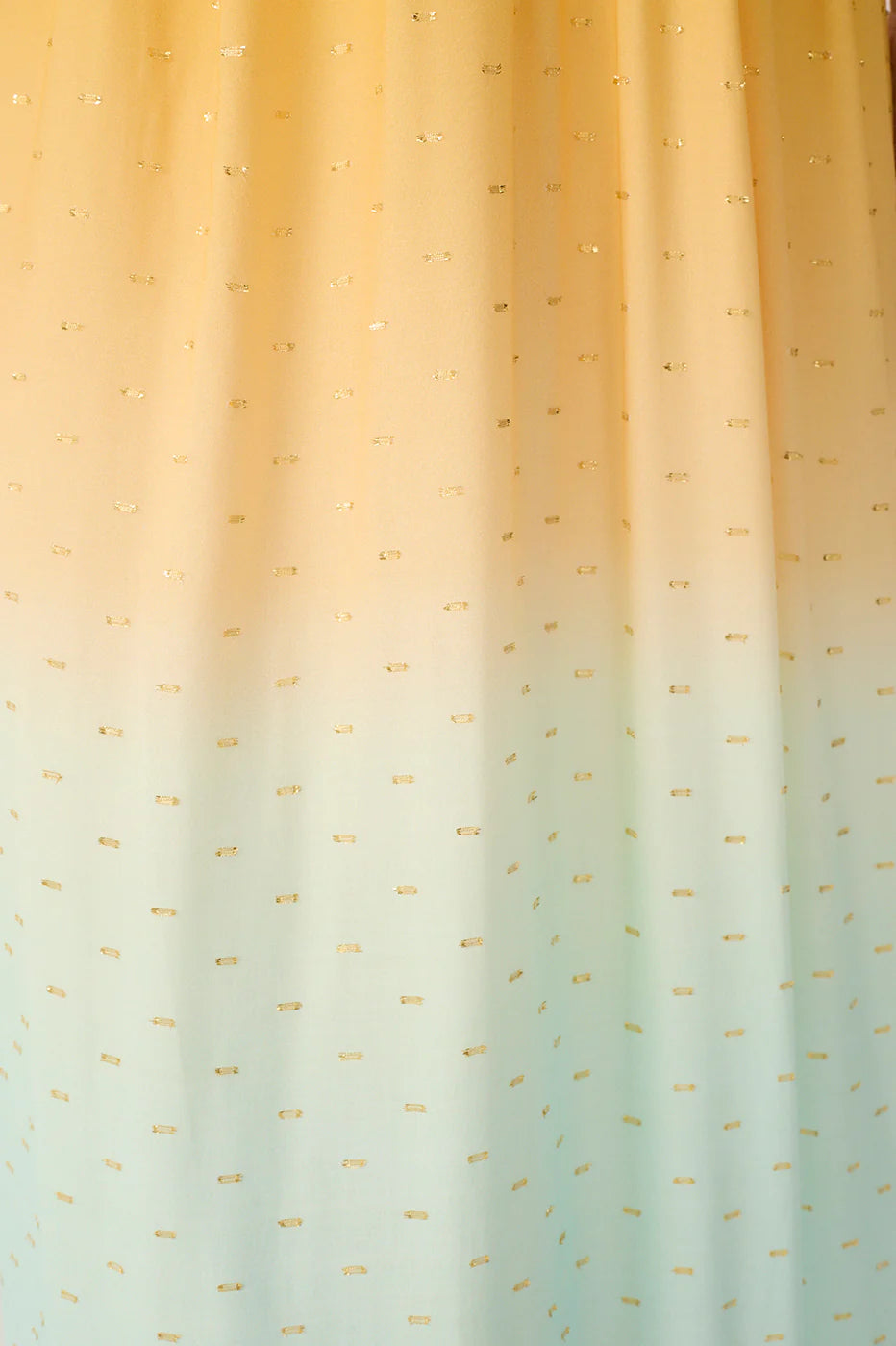 Gradient fabric with gold and green pattern