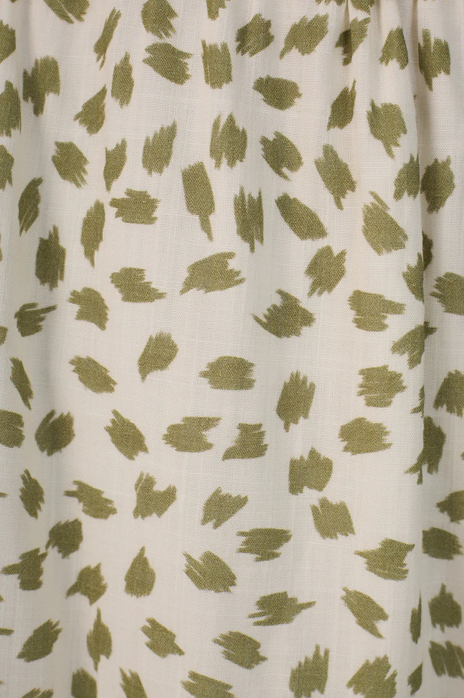 Fabric with green leaf pattern on a white background