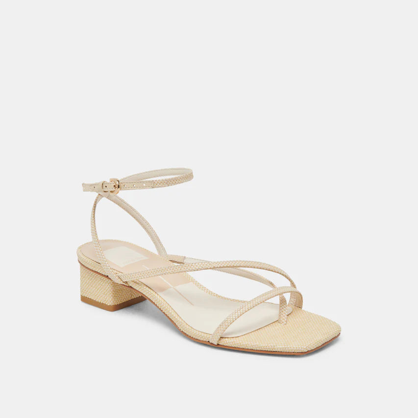 Beige sandal with a block heel on a light gray background