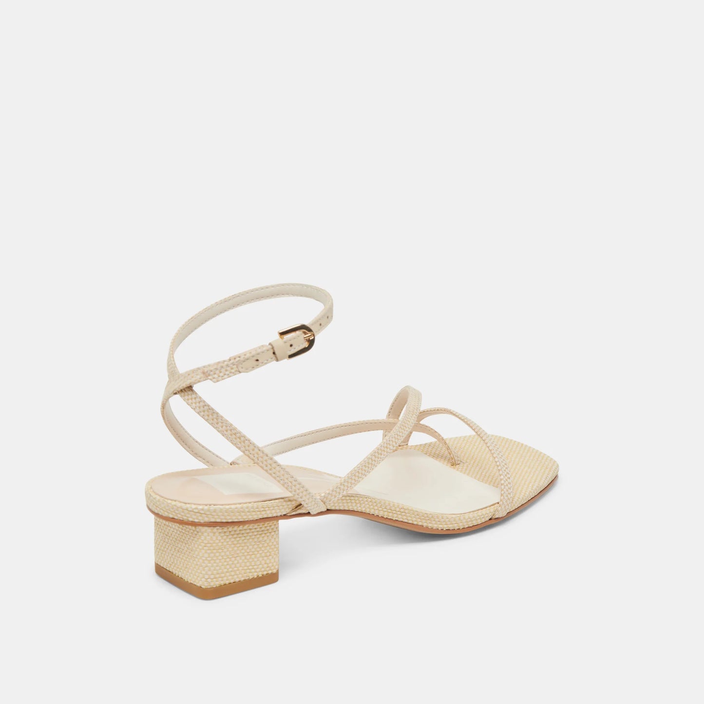 Beige sandal with a block heel on a light beige background