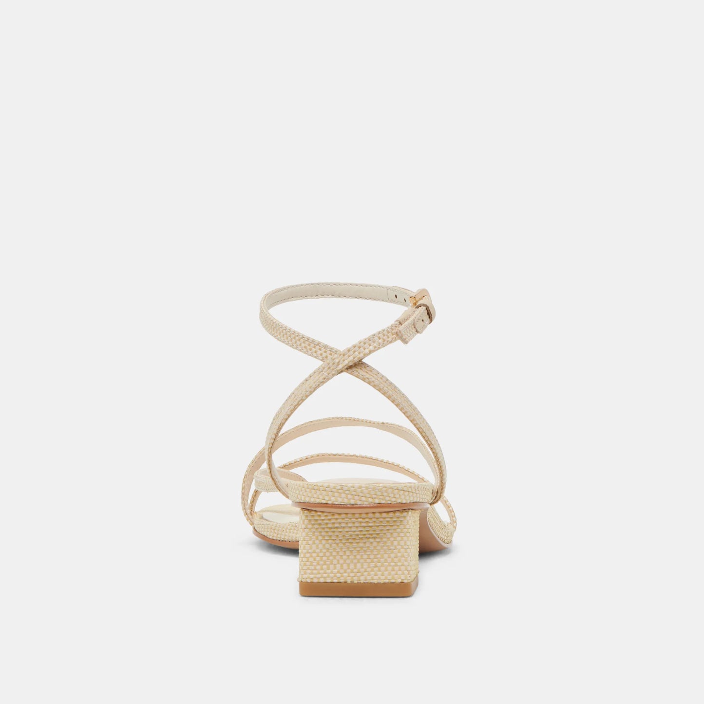 Beige sandal with criss-cross straps on a light beige background