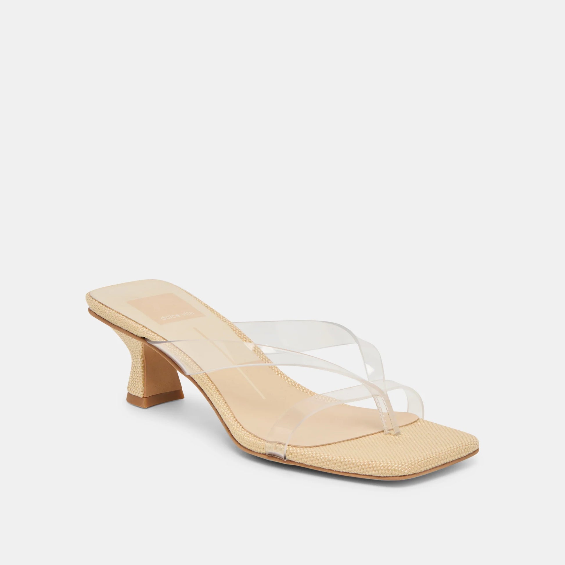 Beige sandal with clear heel on a white background