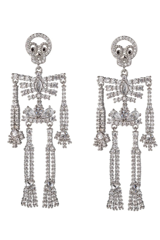 A pair of silver skeleton drop earrings encrusted with clear crystals, shown against a plain white background.