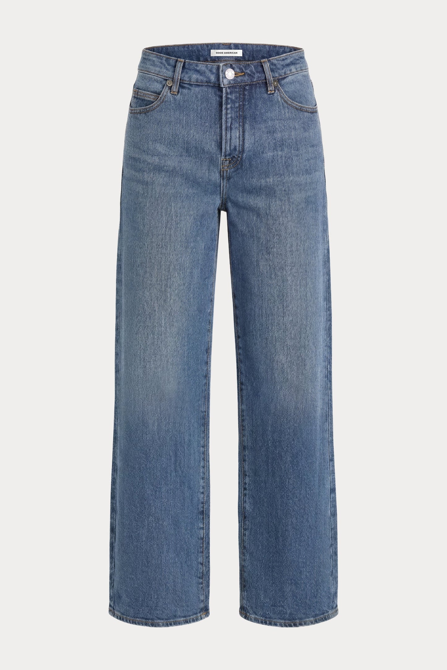 A pair of medium-wash blue denim jeans with a straight, wide-leg silhouette, shown against a plain light gray background.