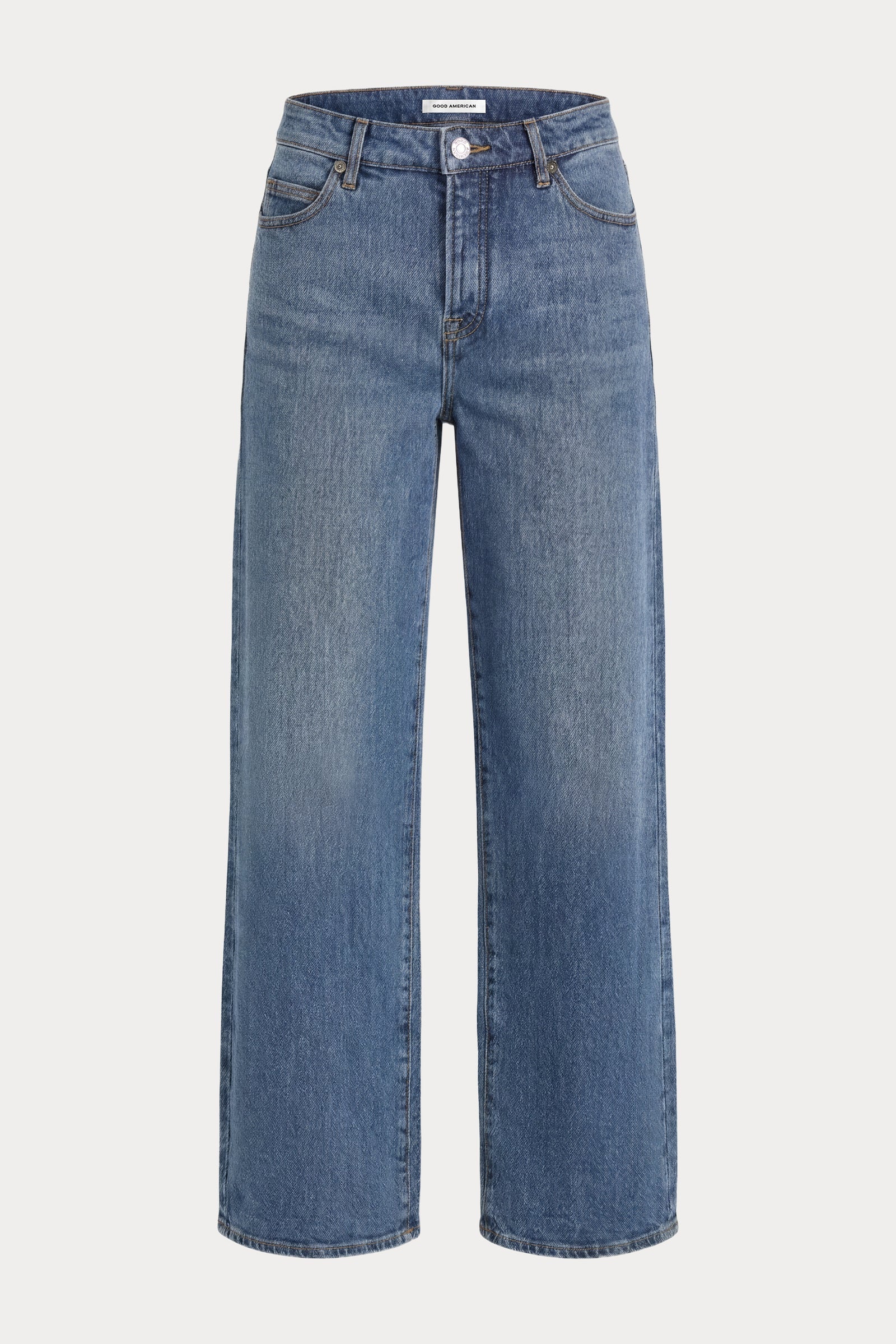 A pair of medium-wash blue denim jeans with a straight, wide-leg silhouette, shown against a plain light gray background.