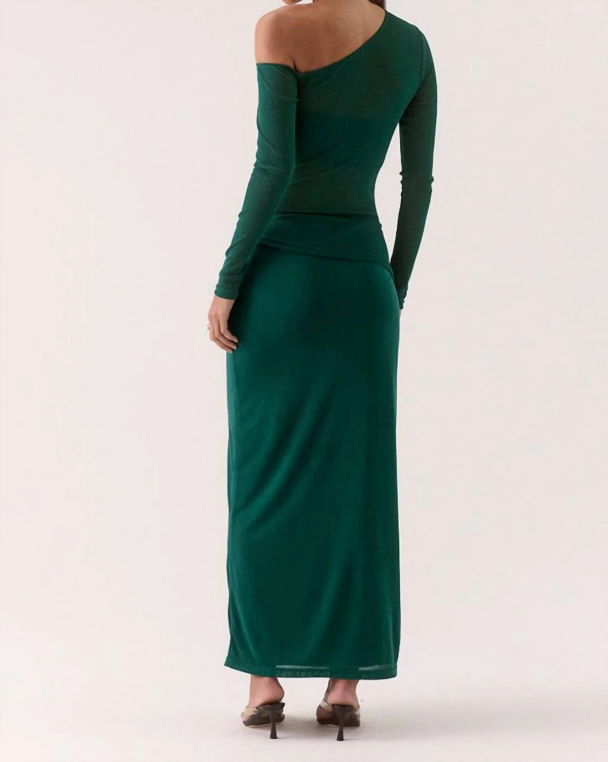 Green evening gown with long sleeves on a white background