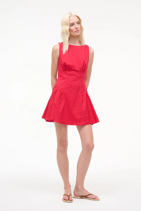 Woman wearing a red dress on a white background