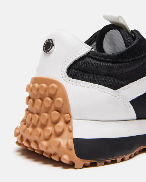 Steve Madden Campo thick soled Sneaker in Black and white With a brown tread and silver Steve Madden branding on the heel