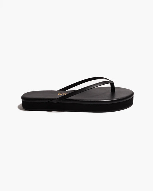 Tkees black platform flip flops on a white background