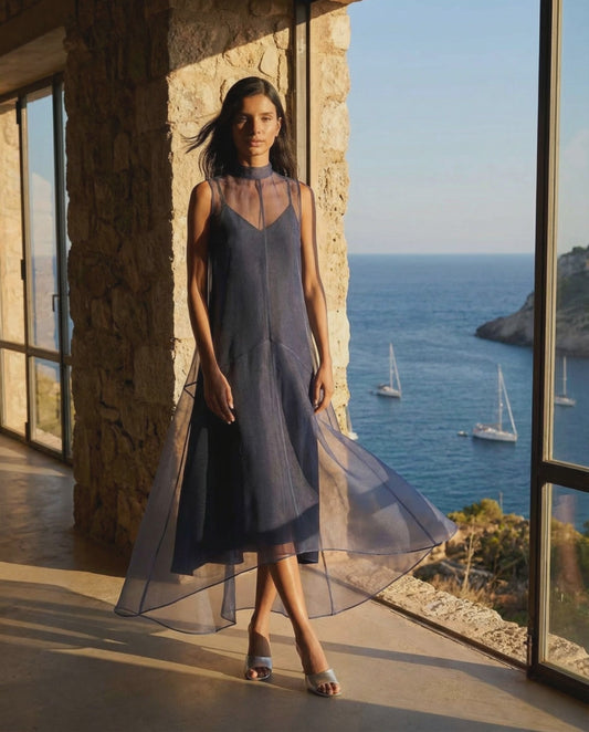 Staud Auden Dress in Navy showing movement and high-low sheer overlay