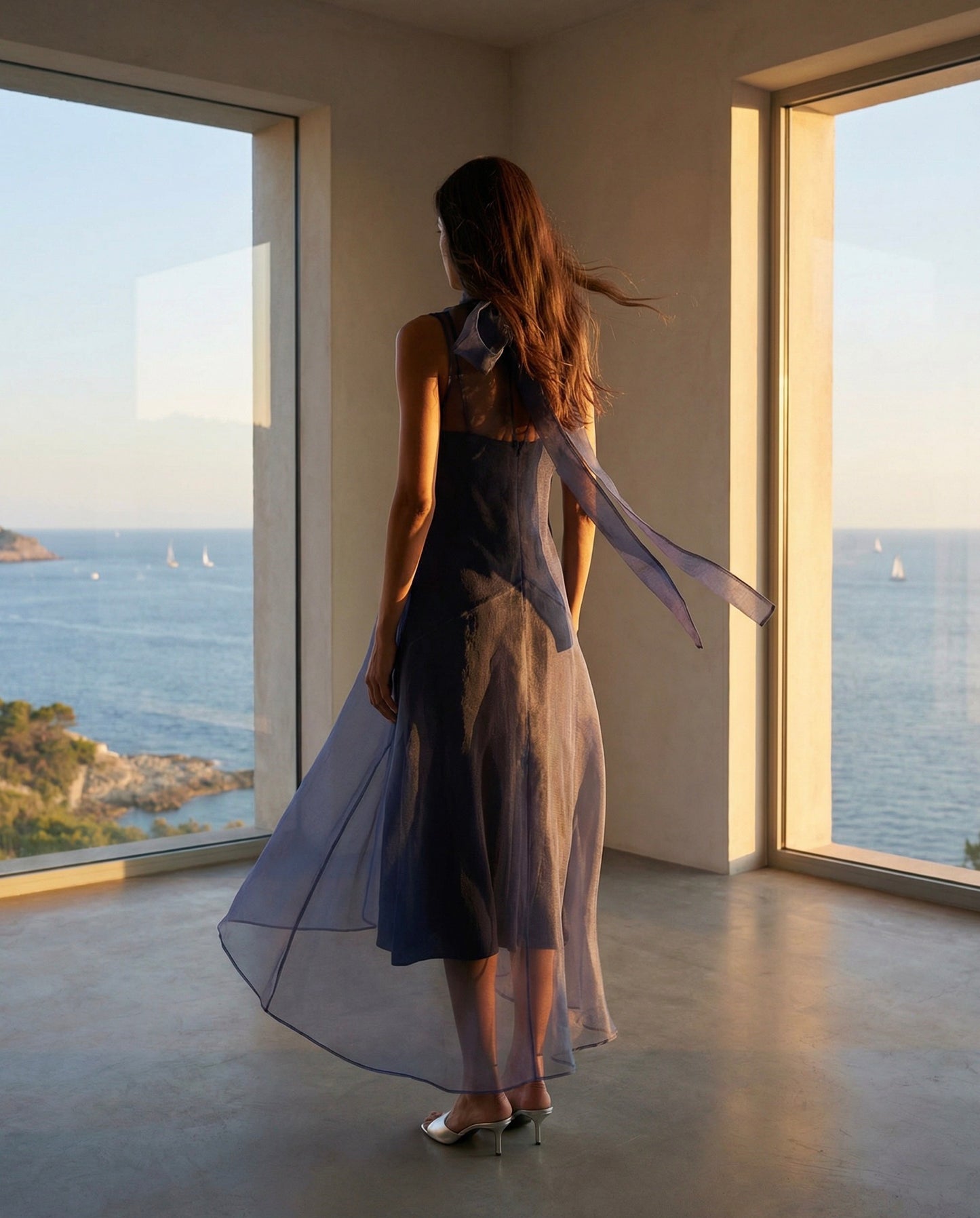 Staud Auden Dress in Navy back view with high-low hem and sheer layered skirt